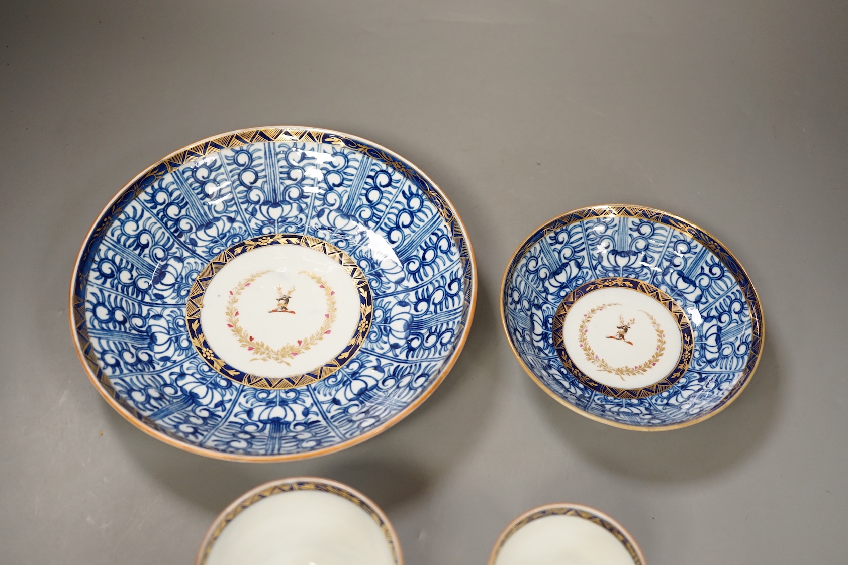 Chamberlains Worcester Armorial teawares, coffee cup, teacup and saucer and a saucer shaped dish, centres with the crest of a stag